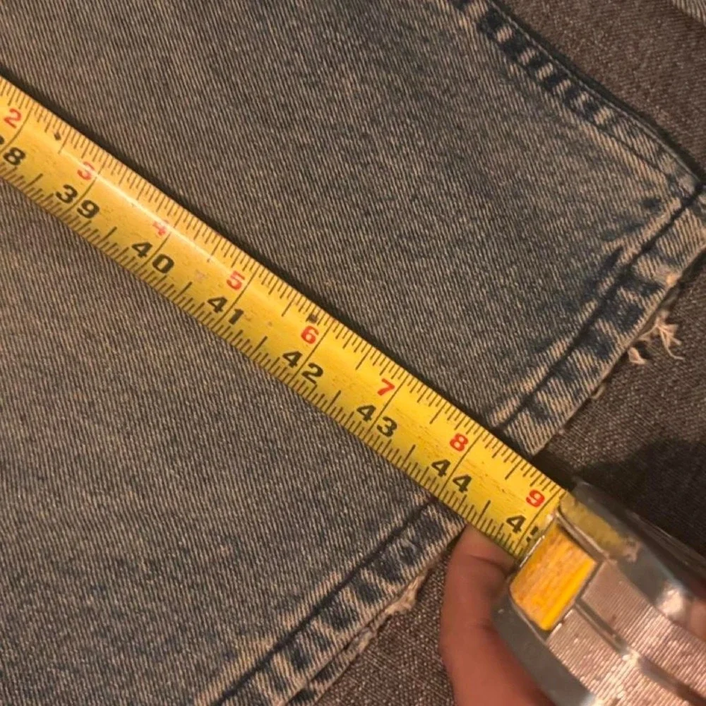 Baggy blue Sean John jeans with a distressed look Size 38x32
